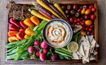 hummus surrounded by vegetables