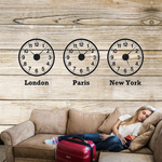 world clocks with a woman on the couch